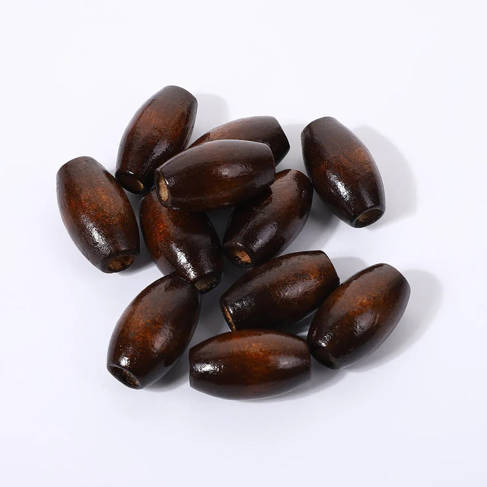 Dark coffee coloured oval wooden beads with M-shaped raised texture, 25mm size
