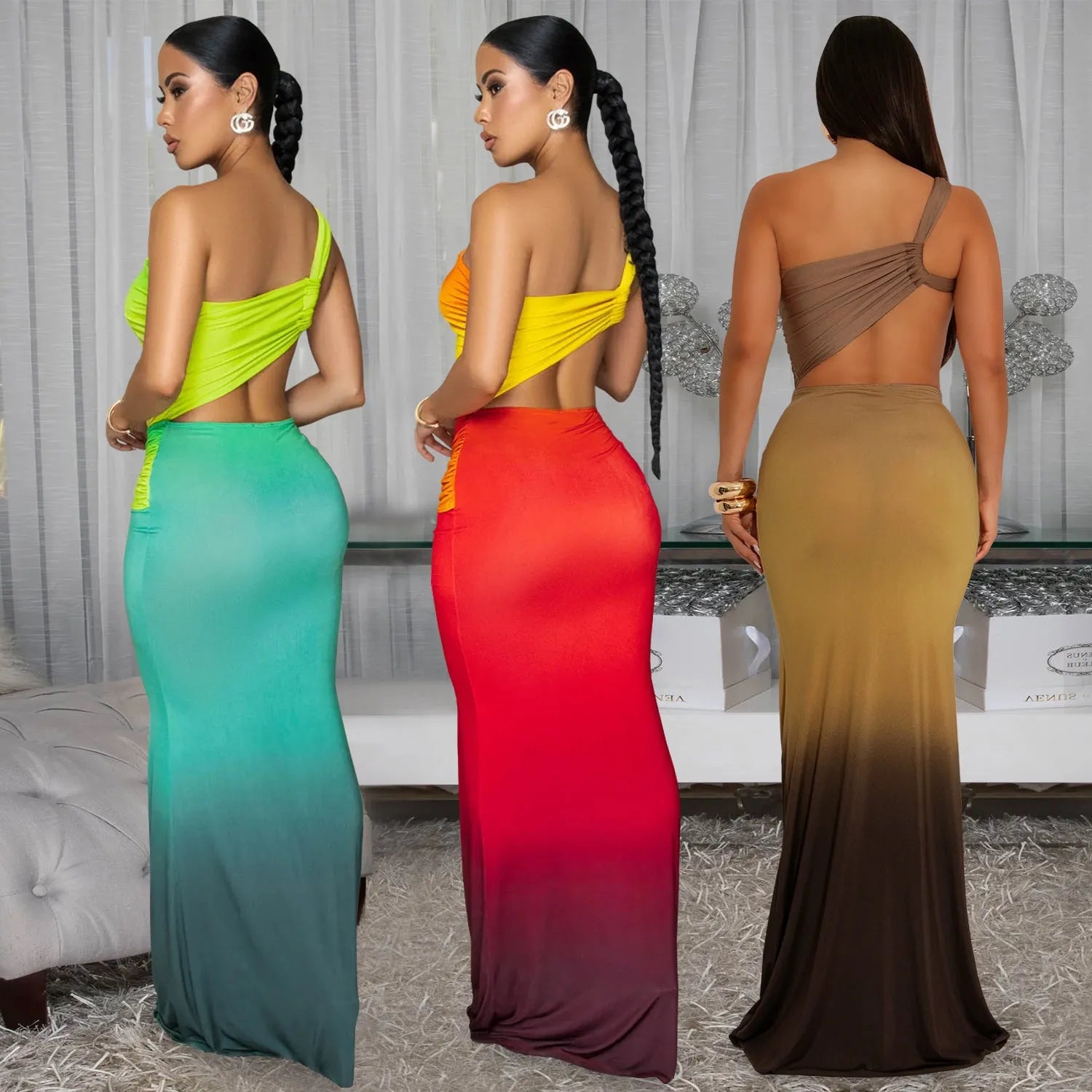 A woman wearing a long, gradient-coloured dress with a cross-shoulder design and high waist.