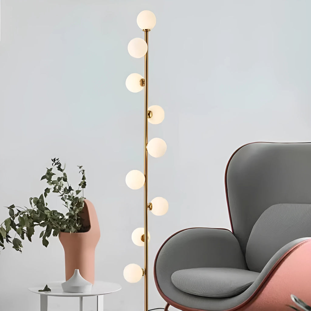 Tall minimalist Nordic floor lamp with wrought iron frame, glass shade, and circular marble base.