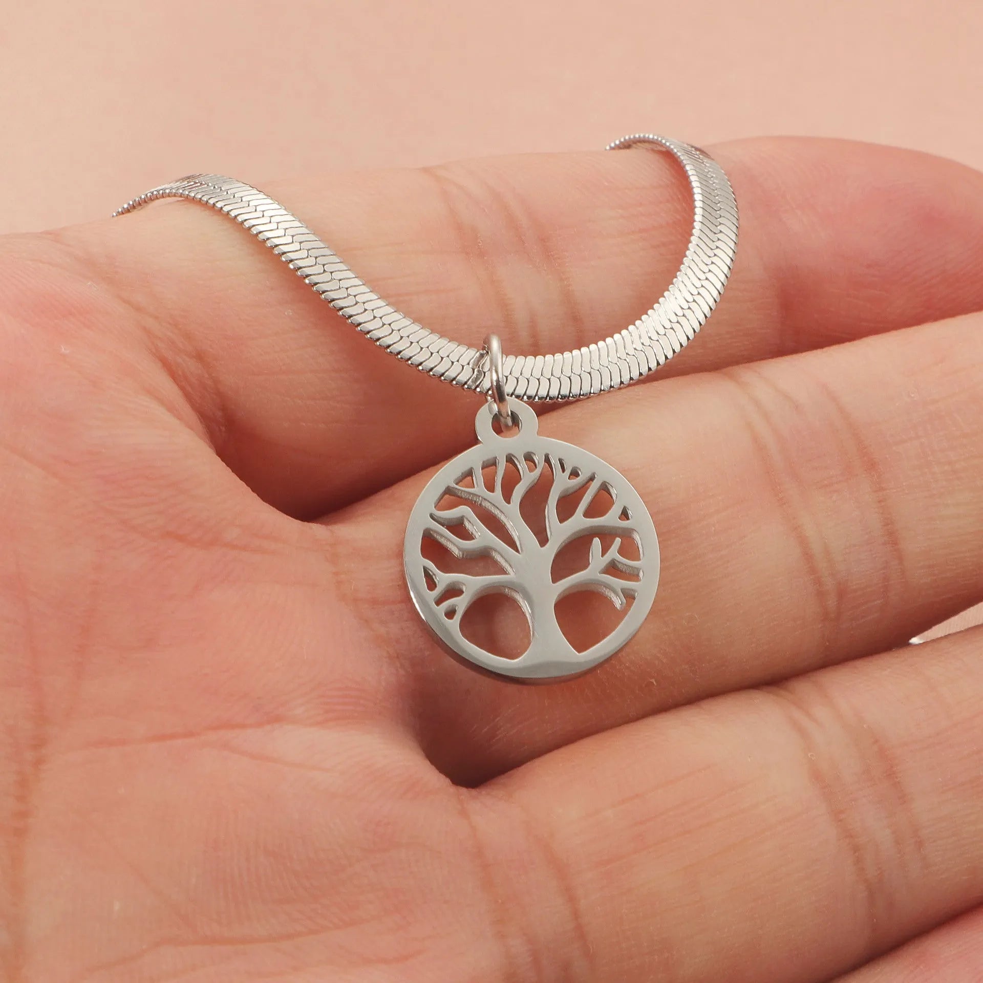 Gold and steel colour adjustable lucky tree pendant necklaces on a snake bones chain.