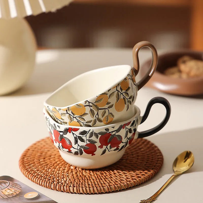 Antique-style ceramic coffee cup and saucer set with a retro pattern in either black or orange.