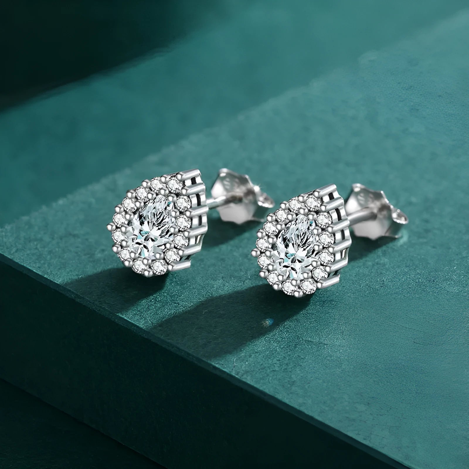 Women's silver water drop ear studs with diamond treatment on 925 sterling silver