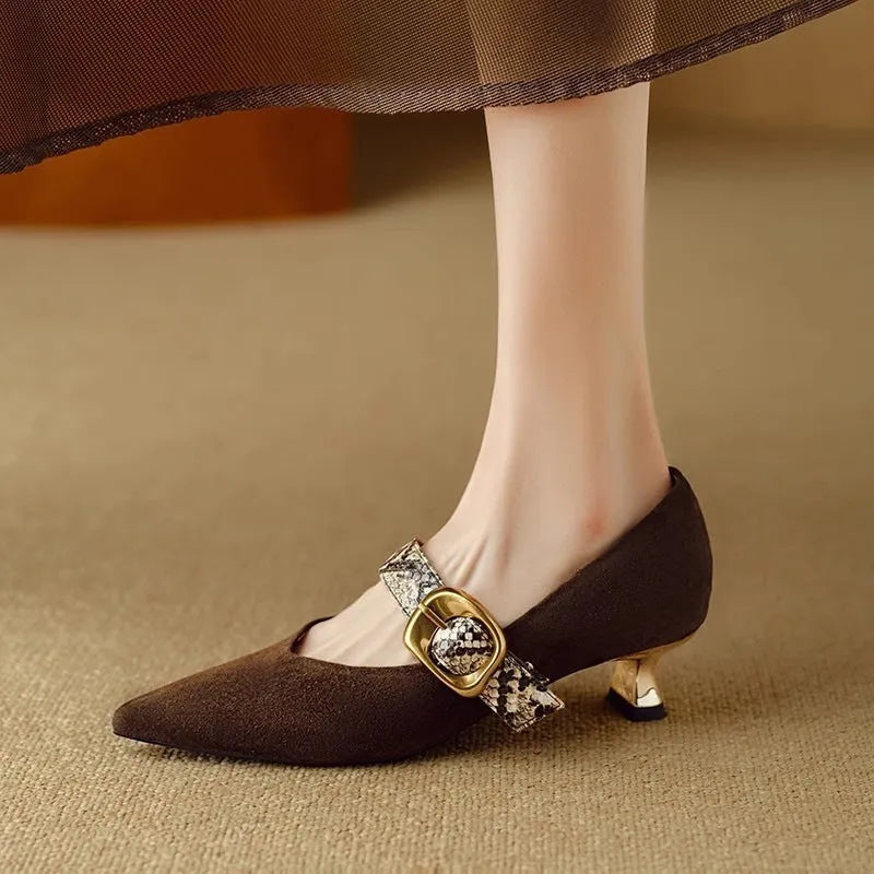 Women's black French point high heels with buckle fastening and stiletto heel
