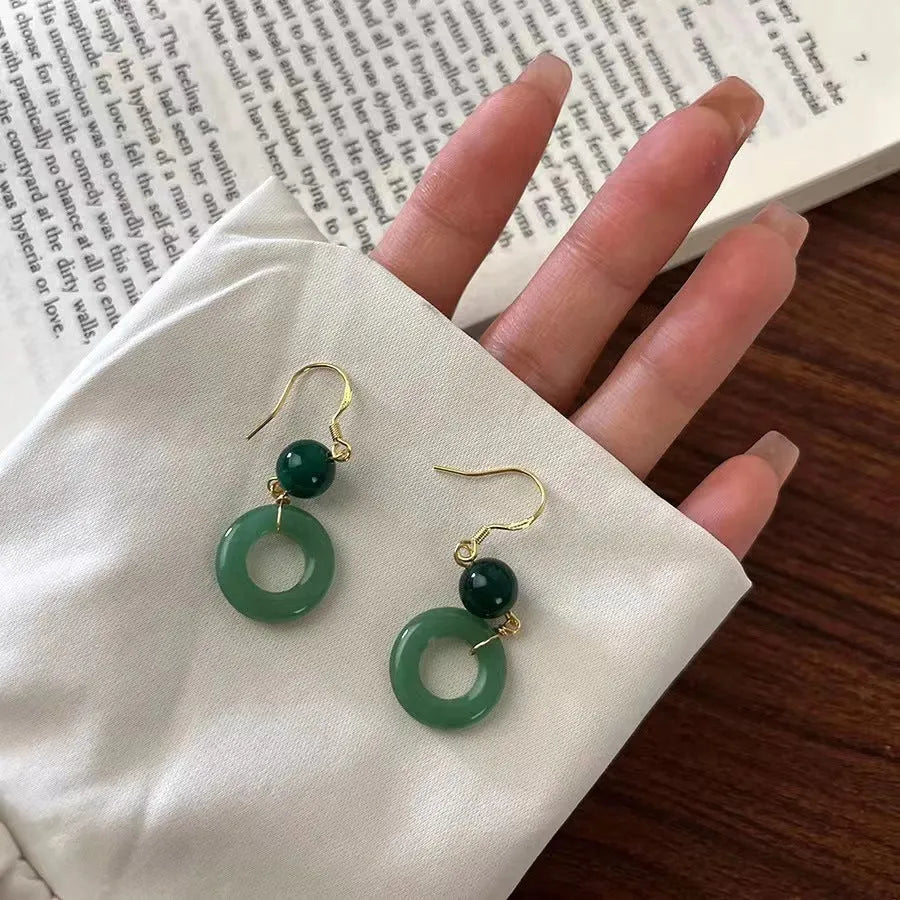 Green Chinese peace buckle earrings with geometric design and gold plating