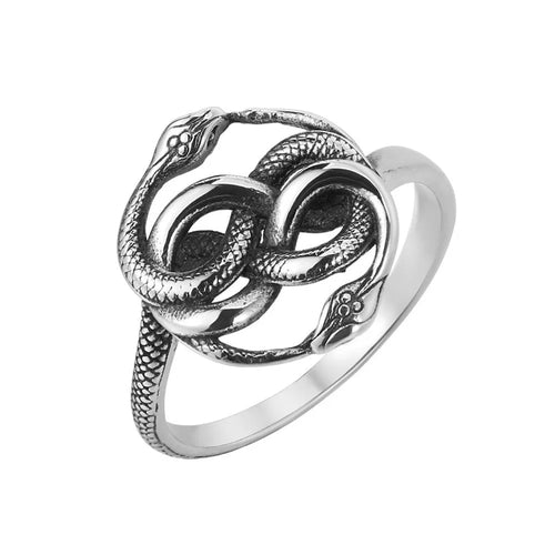 Steel coloured titanium steel double snake ring with a retro design on a finger.