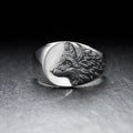 Silver geometric wolf head men's alloy ring on a grey background.