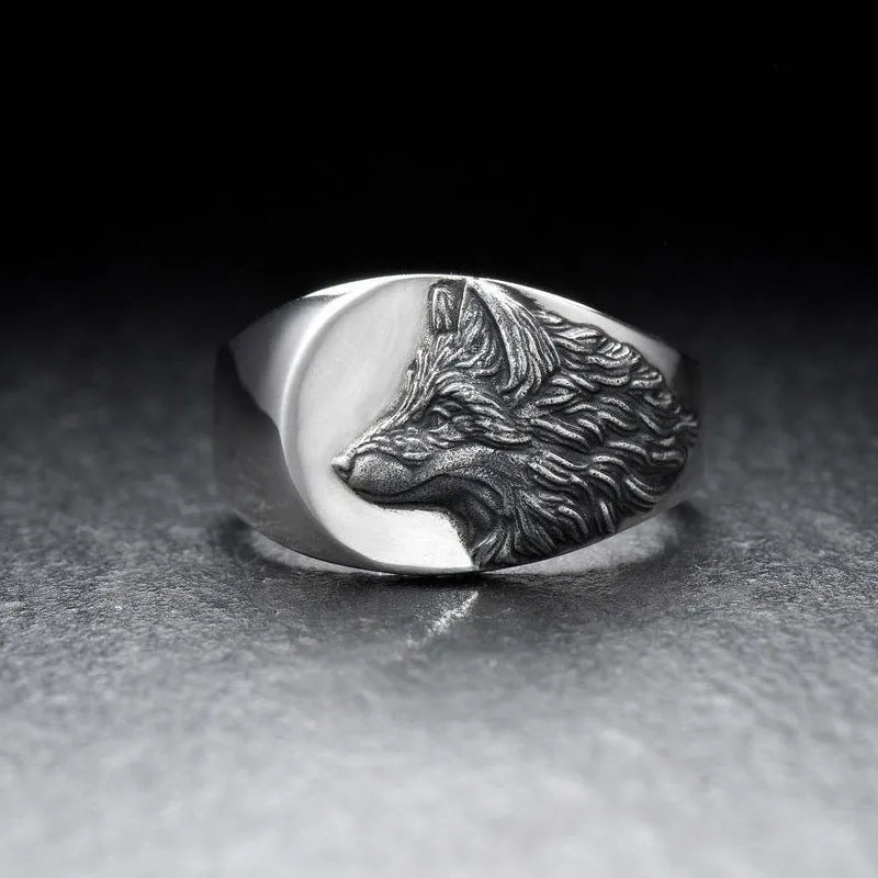 Silver geometric wolf head men's alloy ring on a grey background.