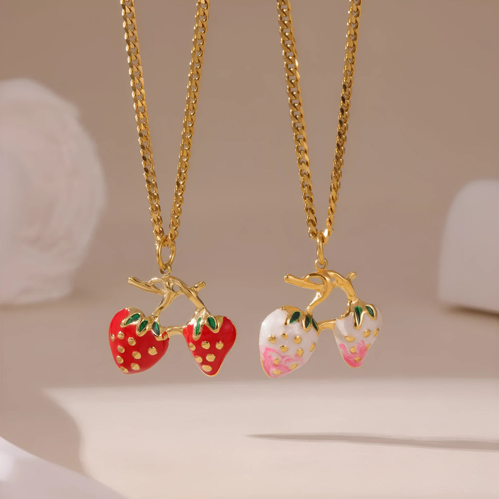 Close-up of a red strawberry pendant necklace on a silver alloy chain with adjustable clasp.