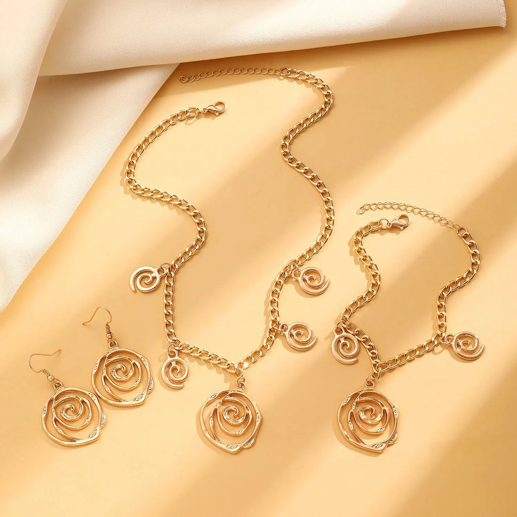 Spiral donut women's jewellery set showing necklace, bracelet, and earrings with geometry circle design