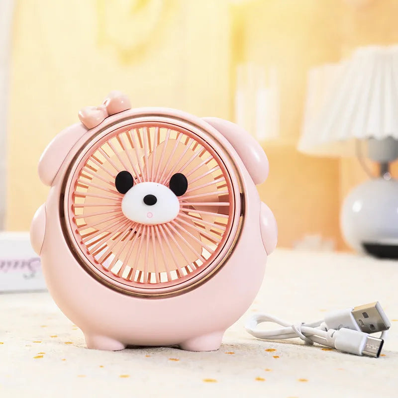 Small plastic desktop electric fan in a choice of six colours, including puppy-themed options, with USB cable.