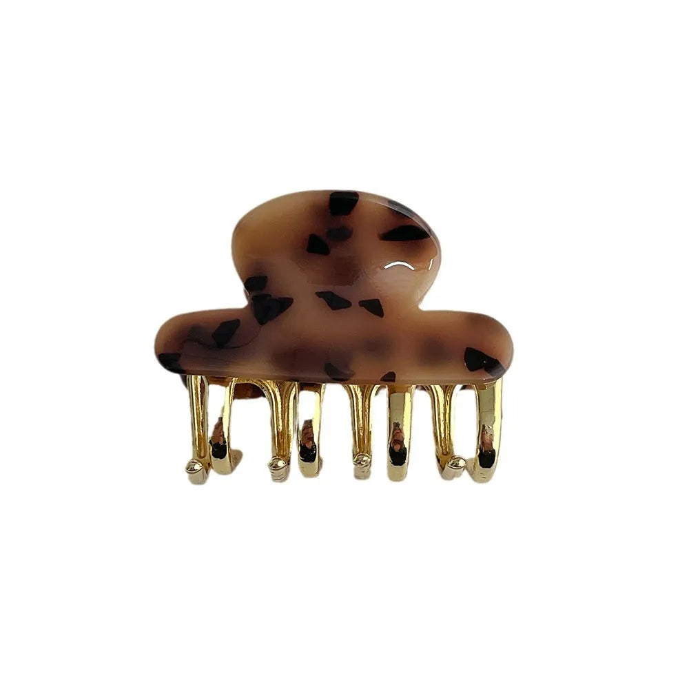 Women's retro acetate hair barrette with metal alloy grip in creamy-white, fairy white, ink colour, and leopard print variations