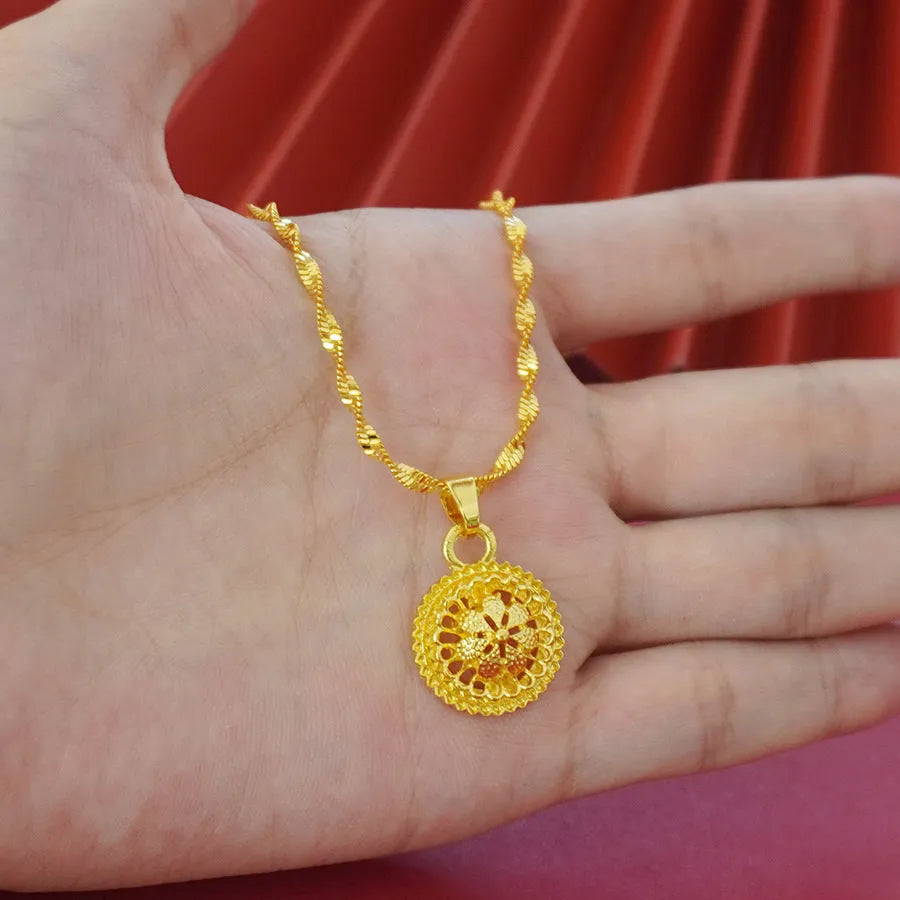 Gold-plated three-piece jewellery set with Middle Eastern flower design, showing necklace, pendant earrings, and ring.