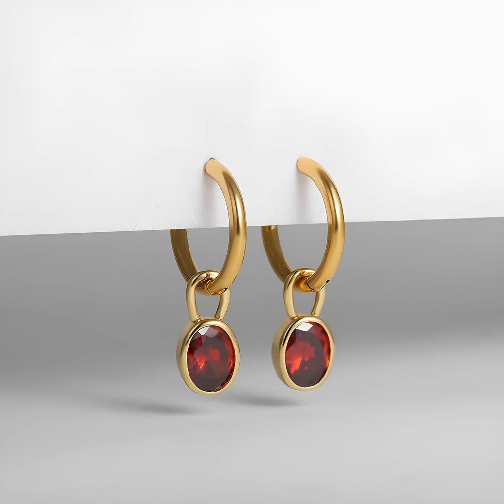 Women's oval zircon clip earrings in army green with polished copper setting on a white background.