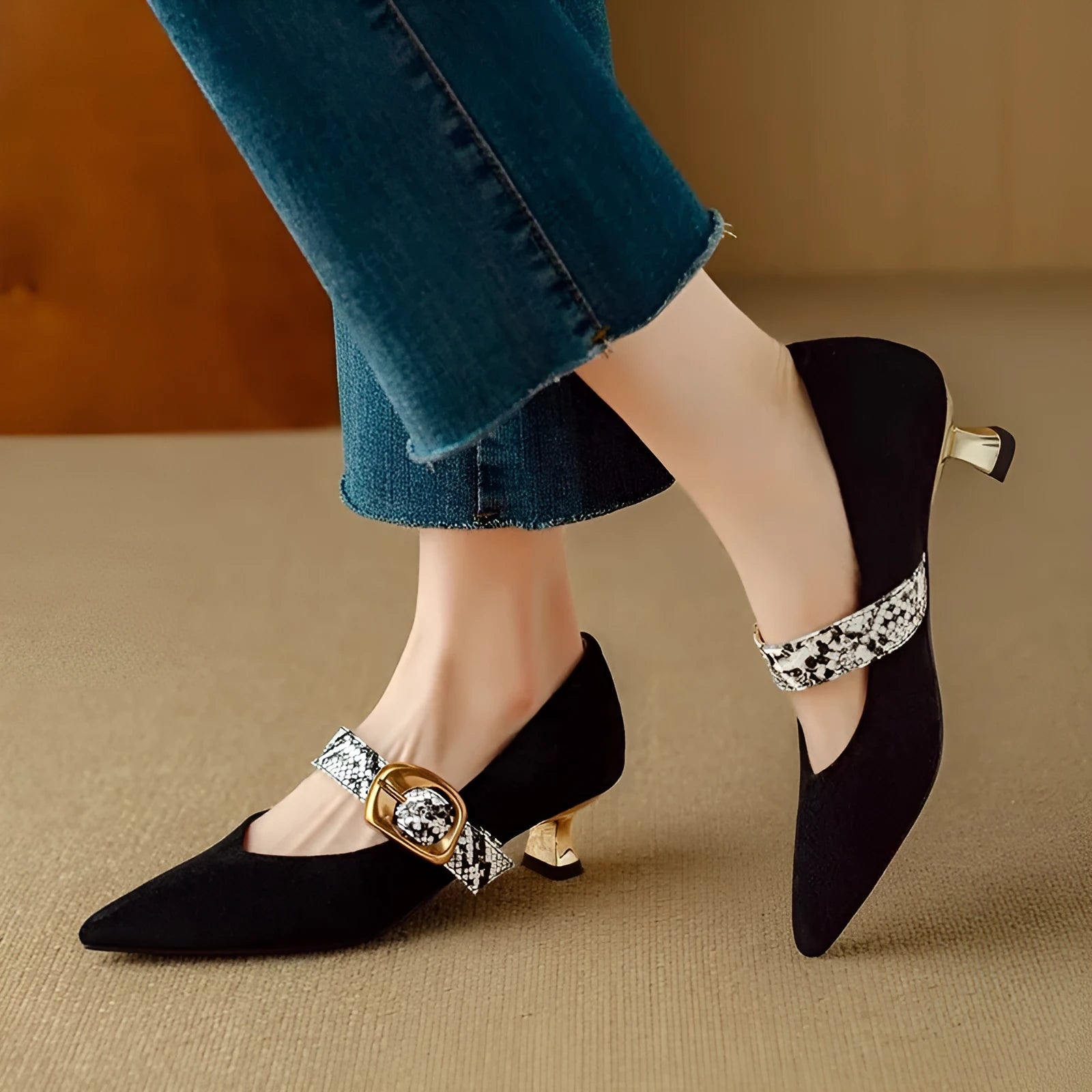 Women's black French point high heels with buckle fastening and stiletto heel