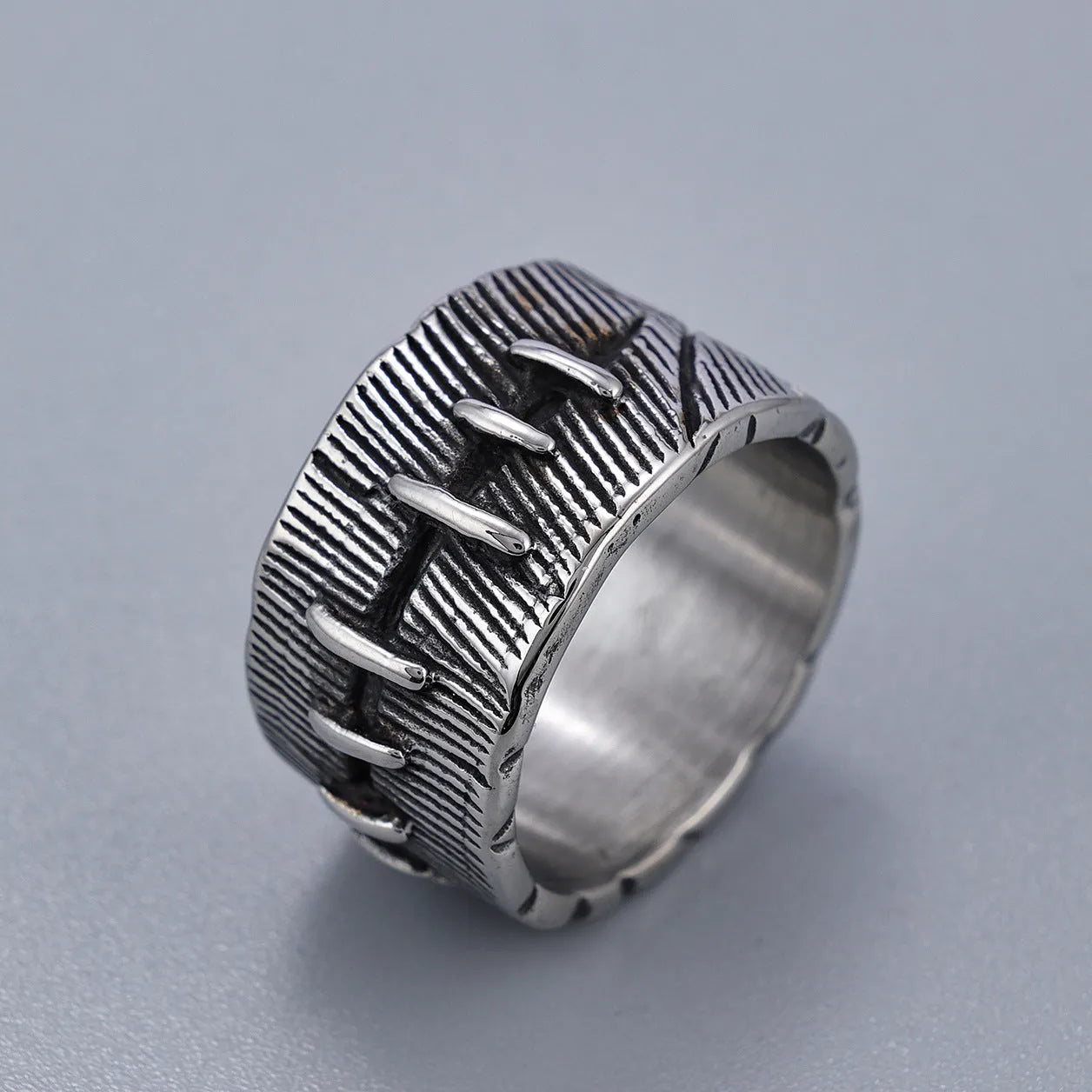 Geometric titanium steel dark punk double ring in a U-shape, shown in a retro colour.