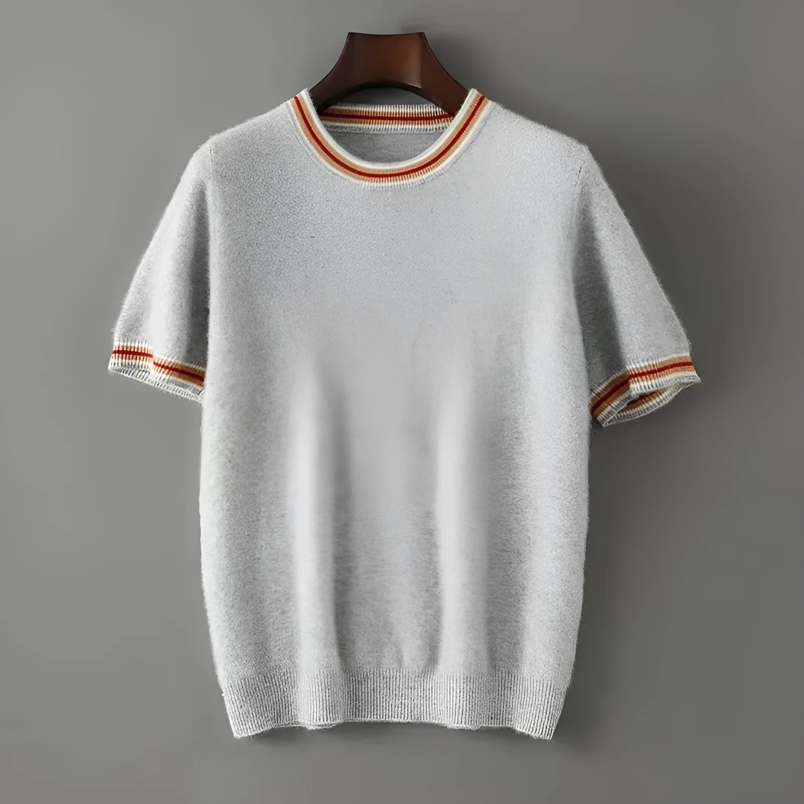 Men's round neck short sleeve pure wool sweater in grey on a hanger.