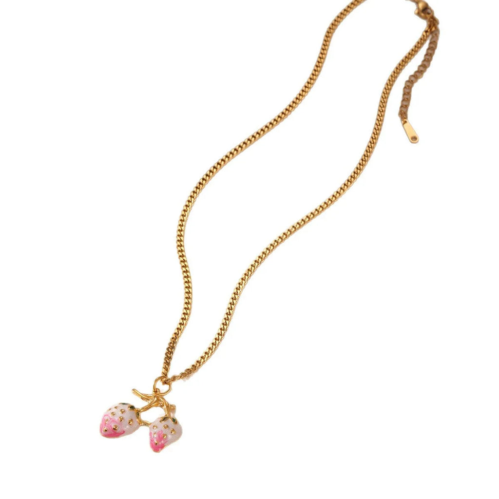 Close-up of a red strawberry pendant necklace on a silver alloy chain with adjustable clasp.