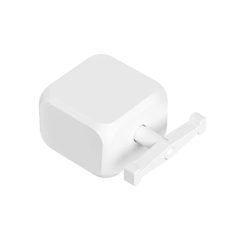 White Bluetooth thumb remote control with rocker arm switch, shown on a person's thumb, dimensions 53mm by 29mm.
