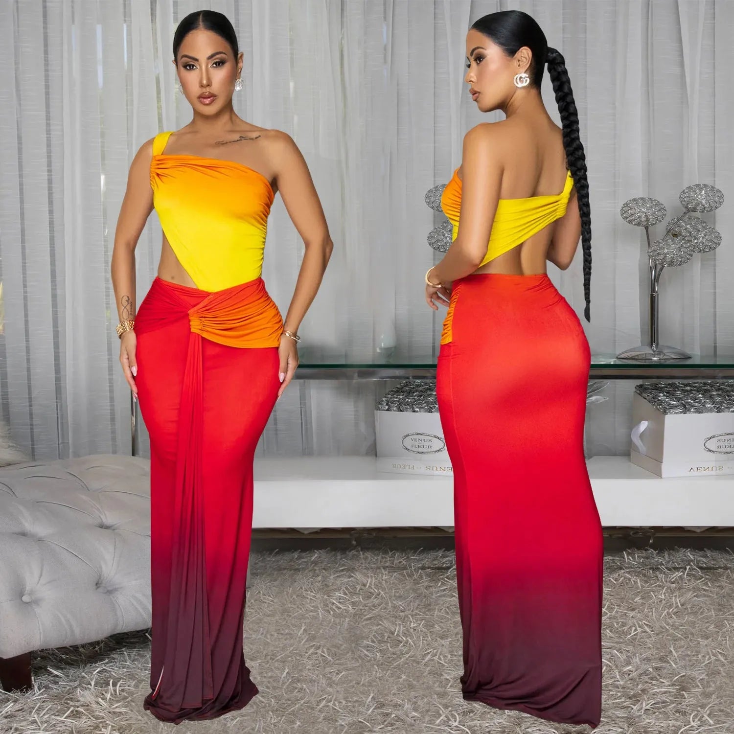 A woman wearing a long, gradient-coloured dress with a cross-shoulder design and high waist.