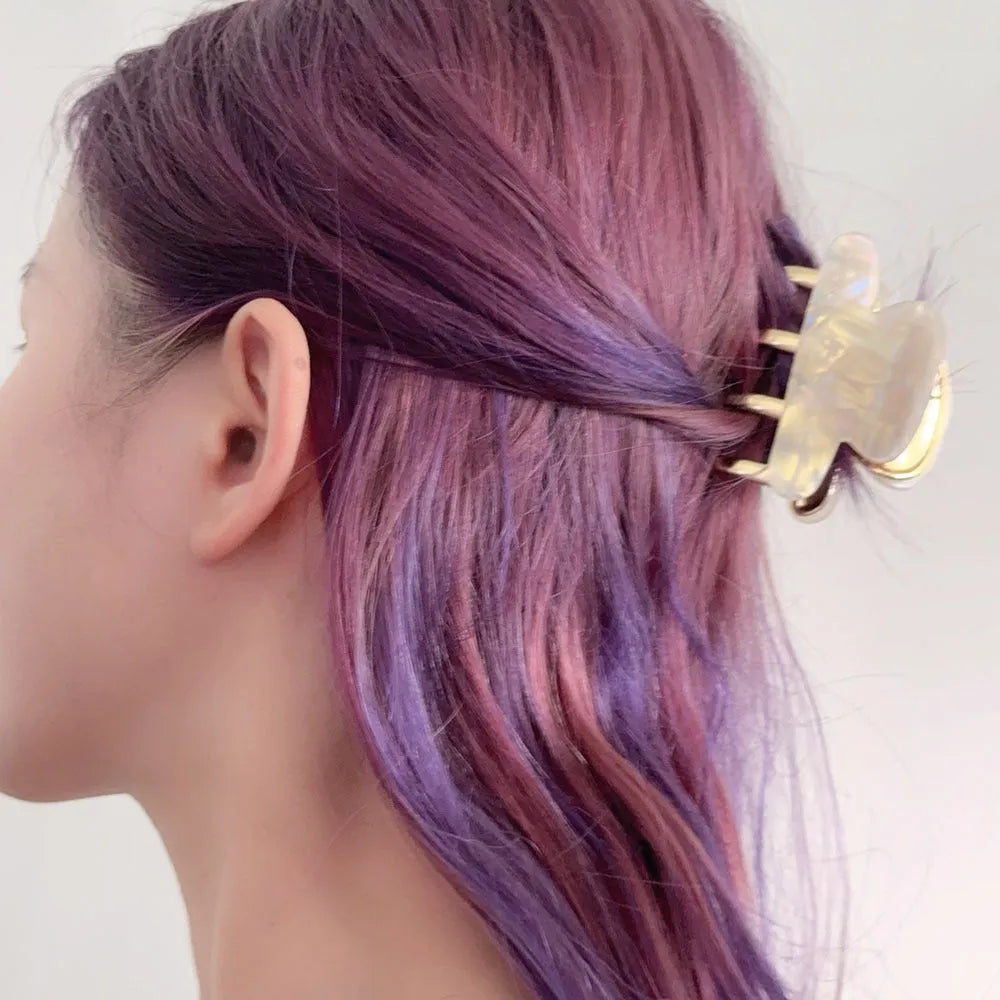 Women's retro acetate hair barrette with metal alloy grip in creamy-white, fairy white, ink colour, and leopard print variations