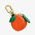 Mini coin bag keychain in cherry red, blueberry blue and orange colours with leather attachment