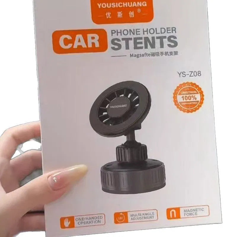Black magnetic phone holder with 360-degree rotation and vacuum base on car dashboard