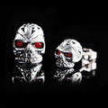 Skull stud earrings with red eye ghost head design and artificial gemstone inlay detailing