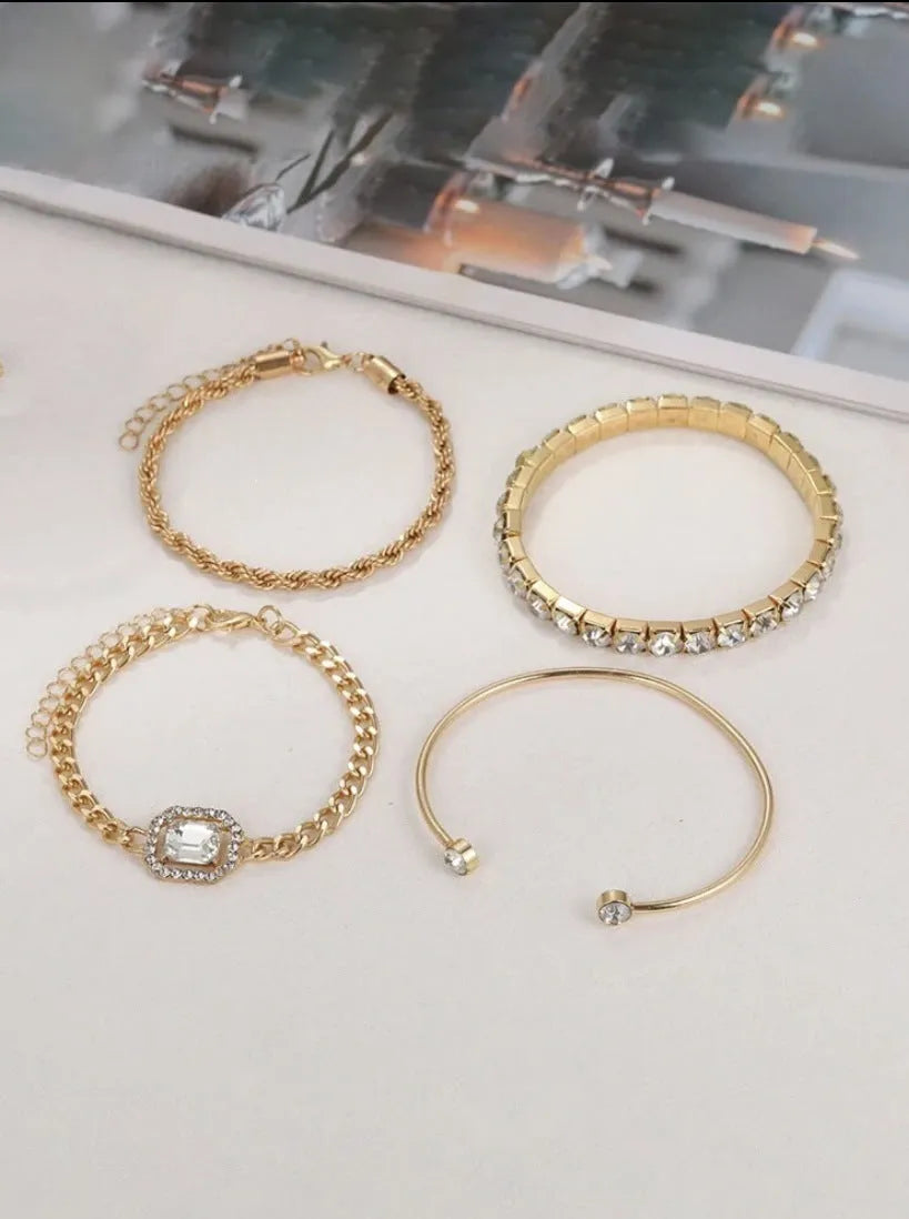 Set of four women's alloy bracelets with geometric square diamond charms and metal chains in gold or silver.
