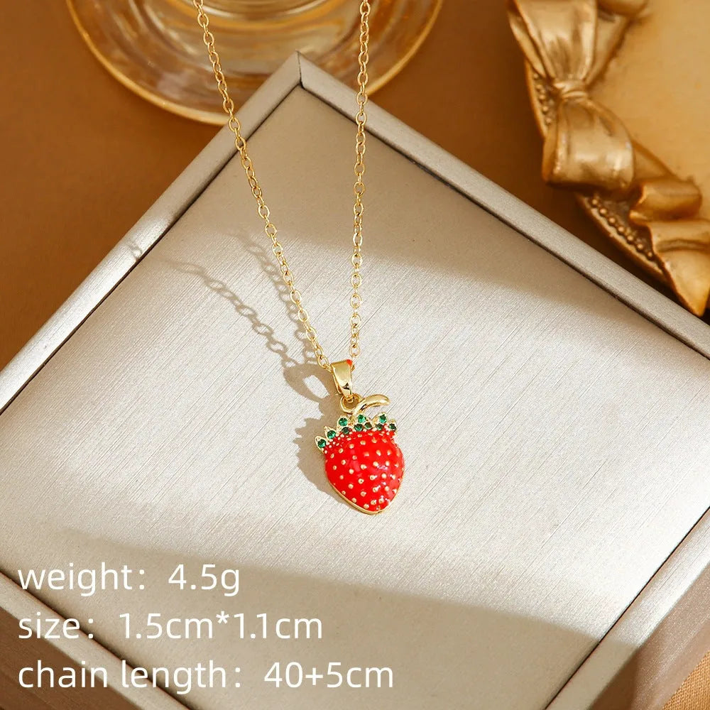 Delicate red indie cherry and strawberry pendant on a titanium steel O-ring necklace chain.
