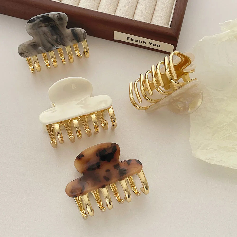 Women's retro acetate hair barrette with metal alloy grip in creamy-white, fairy white, ink colour, and leopard print variations