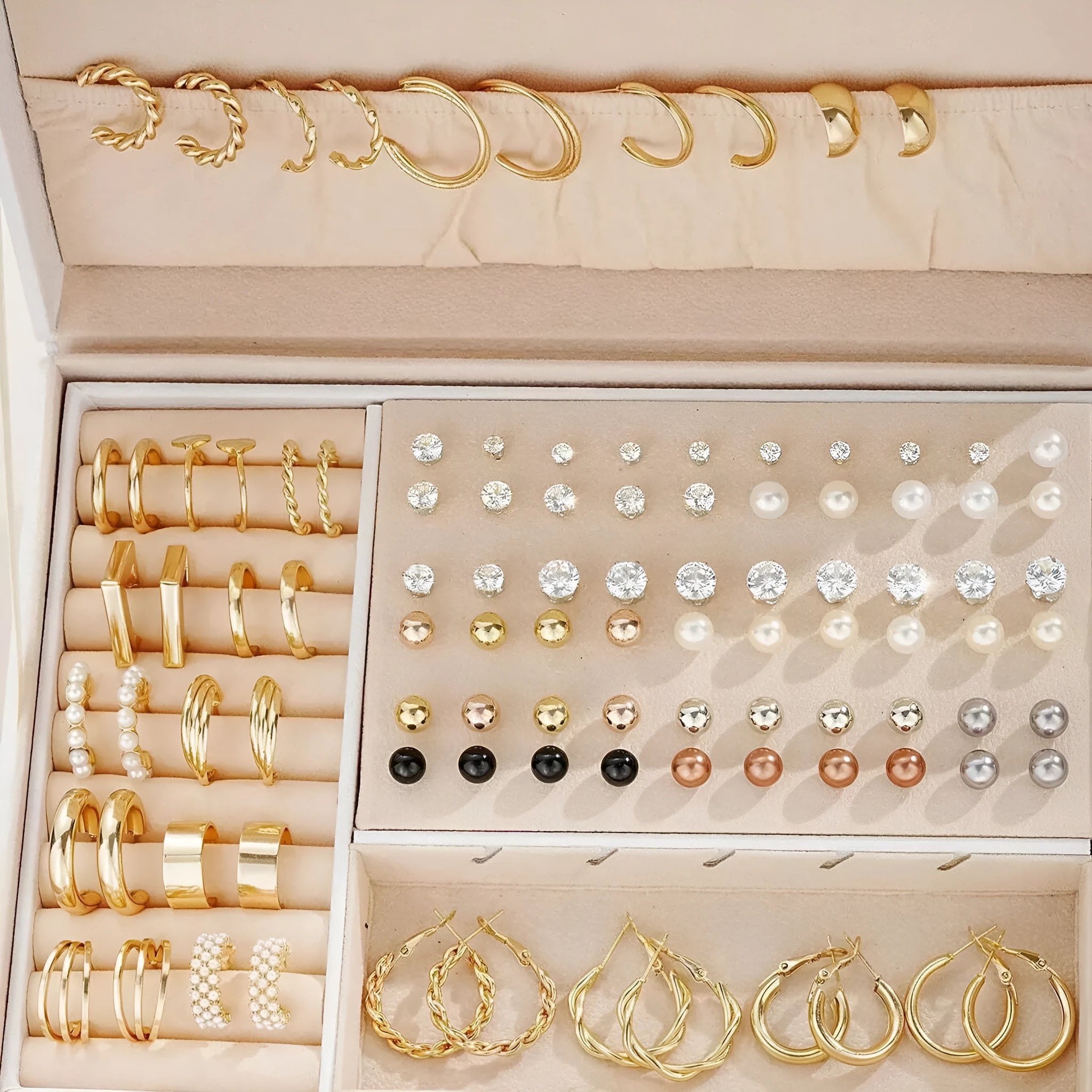 Assortment of 108 gold and yellow geometric alloy earrings with round pearl-like details on a white background.