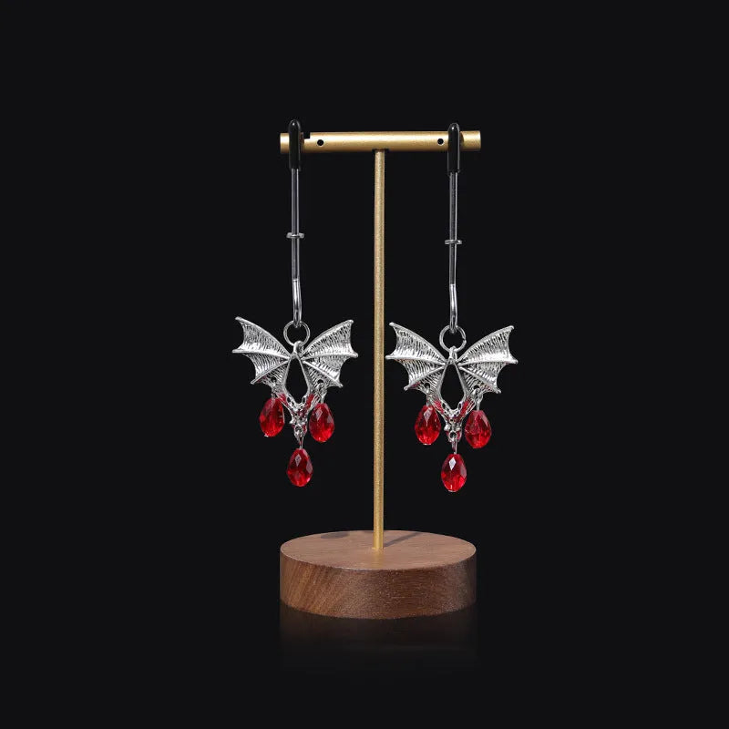Silver alloy bat nipple clamp with adjustable tension and ruby detailing