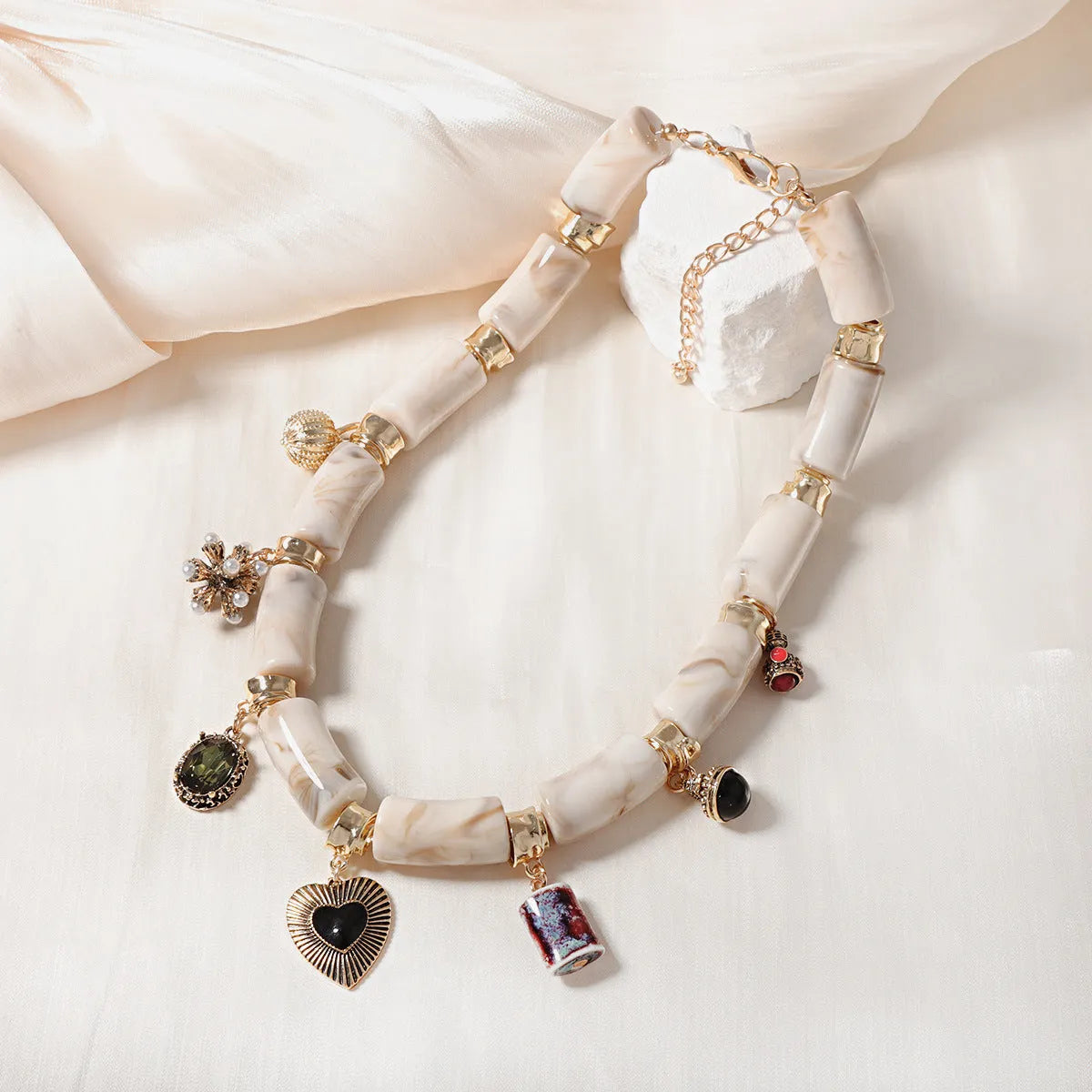 Heart-shaped resin pendant necklace with bamboo detail and adjustable chain