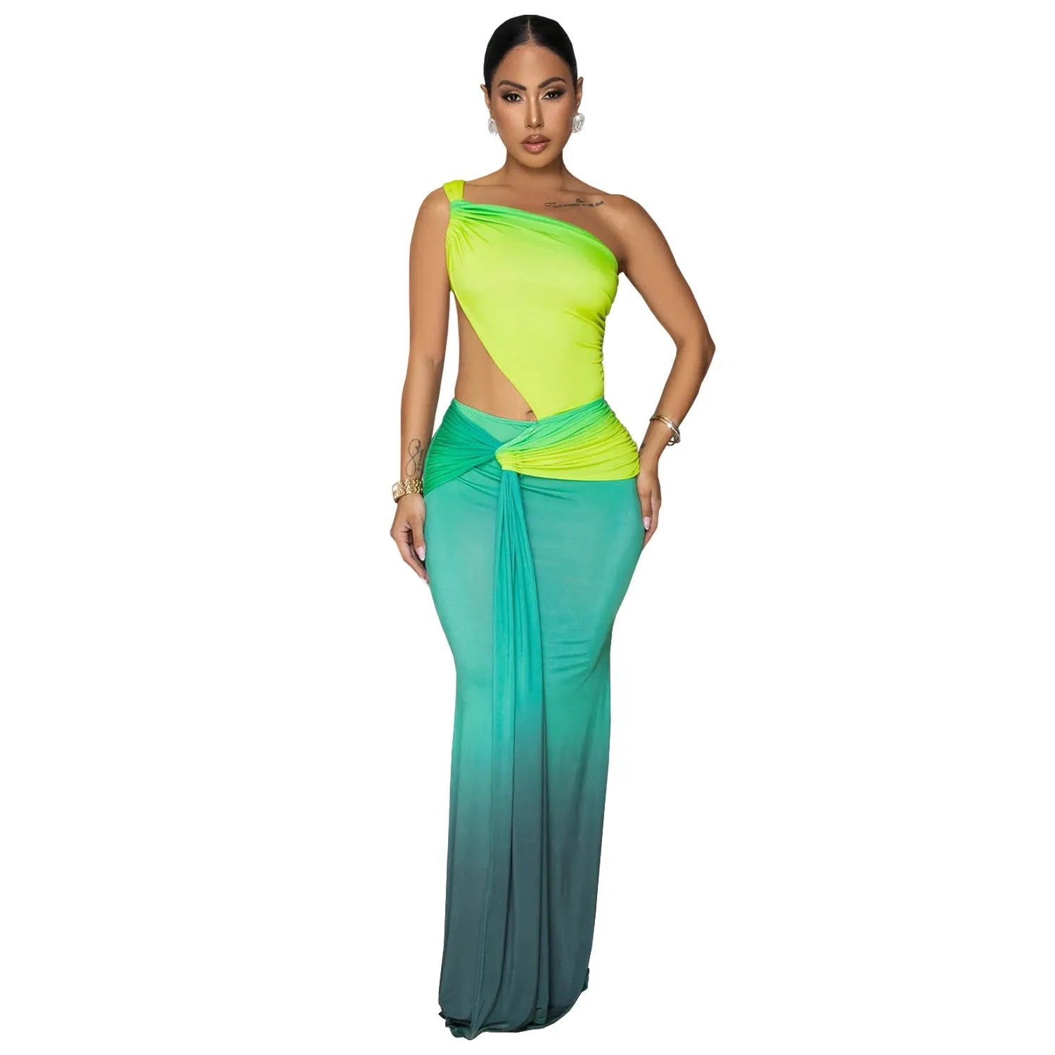 A woman wearing a green gradient oblique shoulder sleeveless long dress with a high waist.