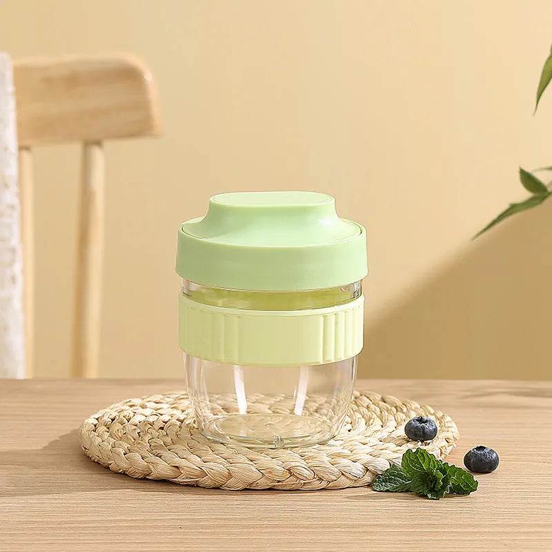 Green microwave-safe plastic salad cup with white lid and spoon, showing leak-proof seal.