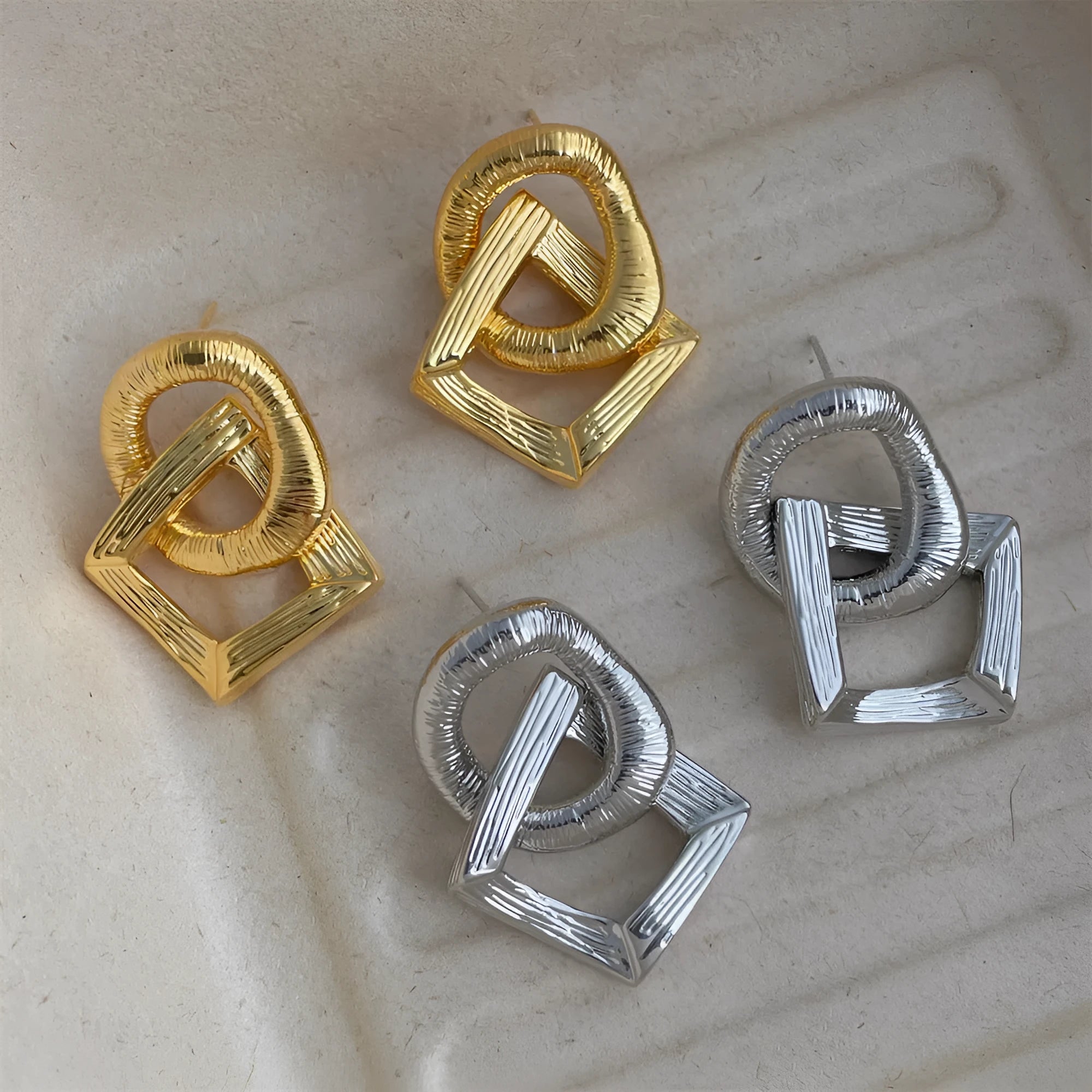 Geometric circle pendant earrings in gold or silver electroplated finish on copper, measuring 3.4cm height