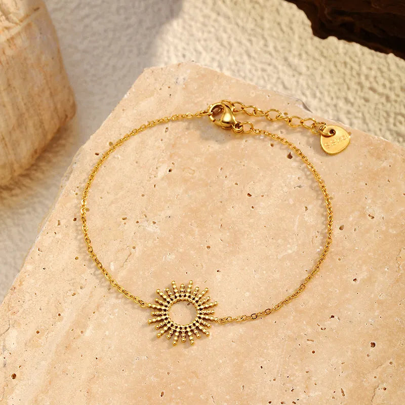 Sunflower Series women's gold necklace and bracelet set with geometric chain design.