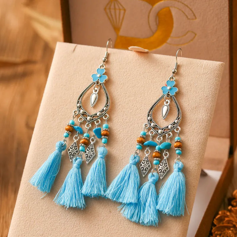 Metal leaf shaped drop earrings with multi-layer tassel and irregular stone ornament in electroplated finish