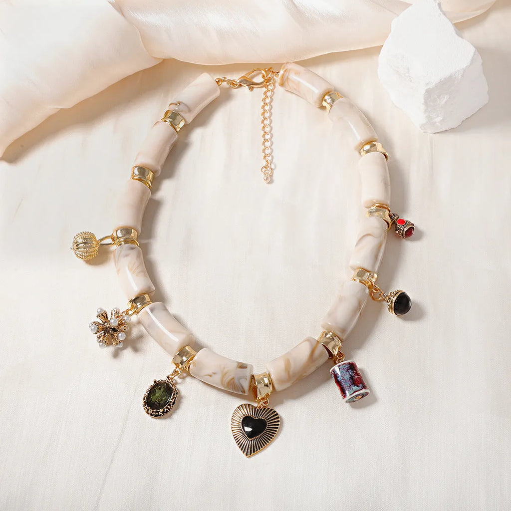Heart-shaped resin pendant necklace with bamboo detail and adjustable chain