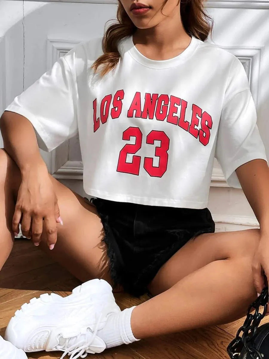 Black loose-fit cotton T-shirt with personalised white English letter print and a navel-revealing cut.
