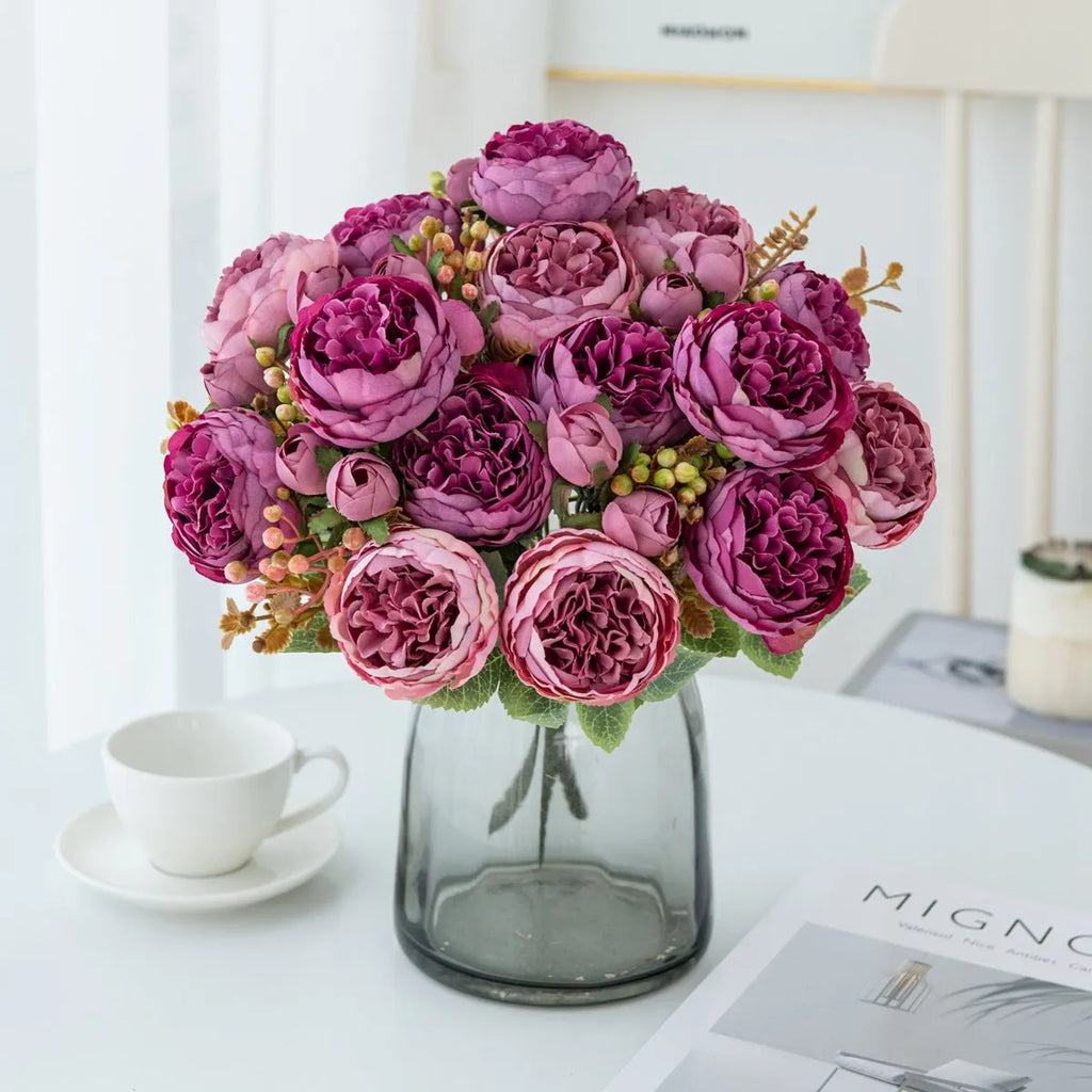 Artificial silk peony bouquet in a vase, showcasing weighted stems and champagne-coloured blooms.