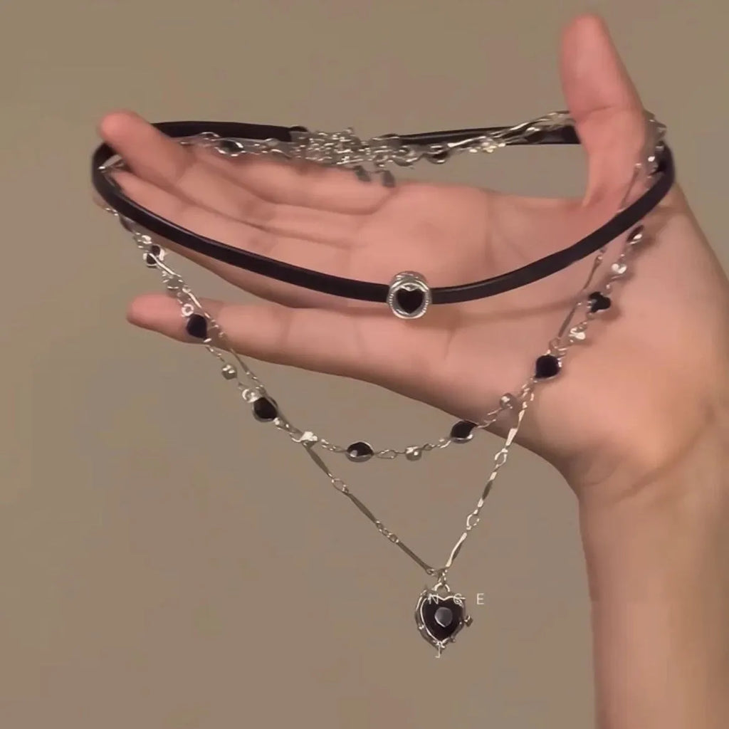 Women's multi-layer heart necklace with adjustable chain, alloy pendant, and artificial crystals.
