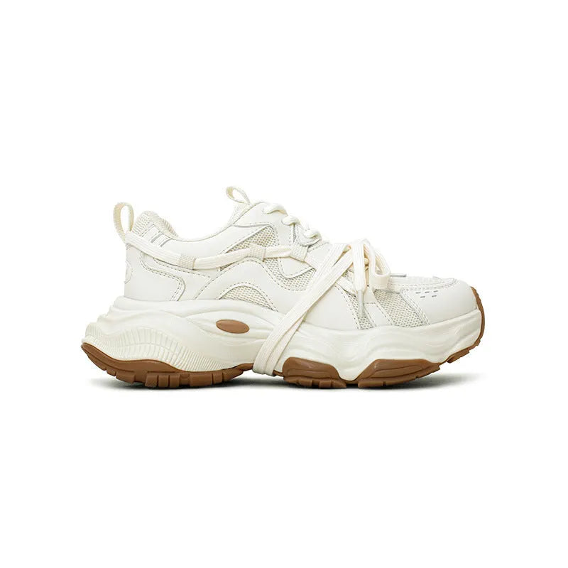Women's beige platform running sneakers with round toe and lace-up design on white background