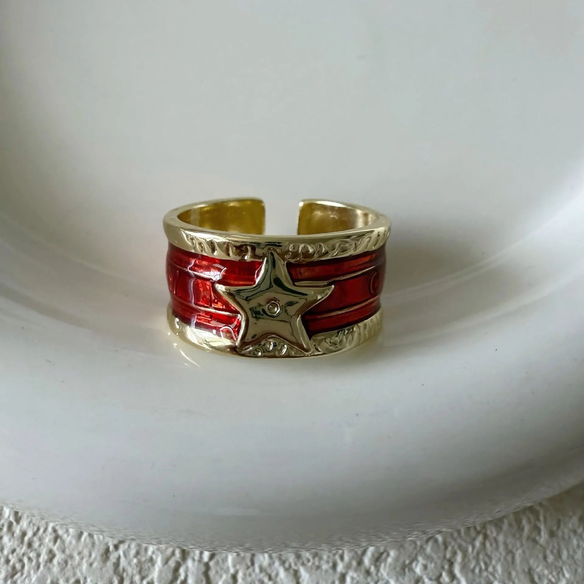 XINGX geometric drop oil ring in a retro distressed finish with adjustable sizing.