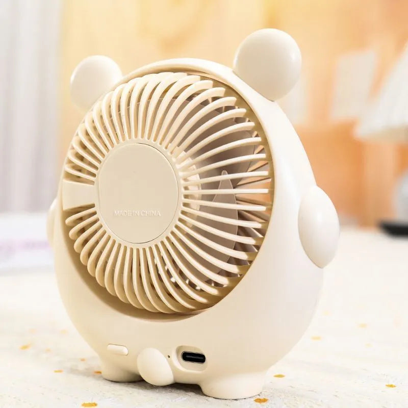 Small plastic desktop electric fan in a choice of six colours, including puppy-themed options, with USB cable.