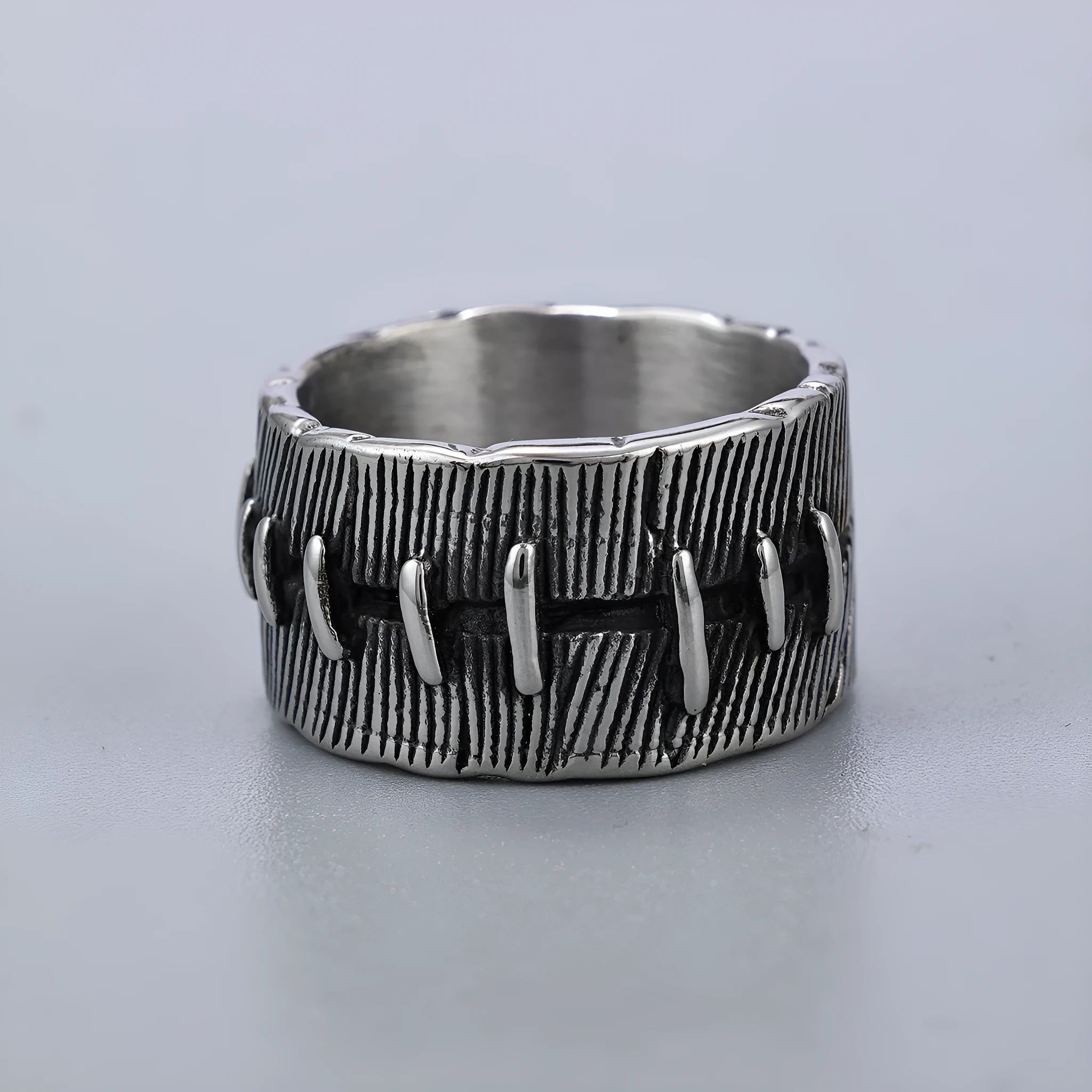 Geometric titanium steel dark punk double ring in a U-shape, shown in a retro colour.