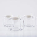 Transparent spill-proof plastic drinking cup on a plain background
