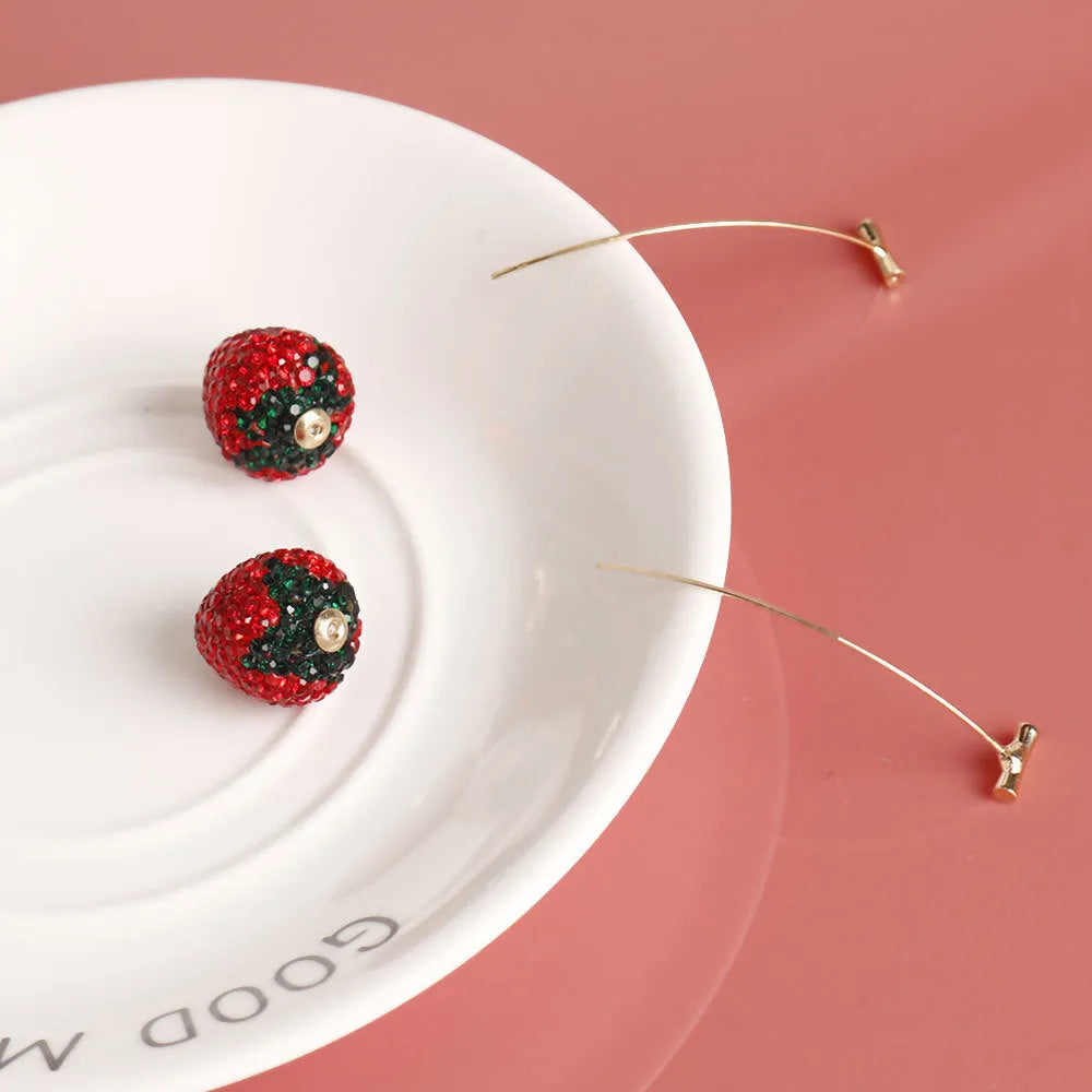 Geometric strawberry-shaped zinc alloy earrings with spot drill texture, shown in red finish with butterfly clasps.