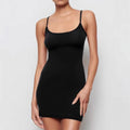 Black sleeveless sling dress with a skinny sheath fit and short skirt.