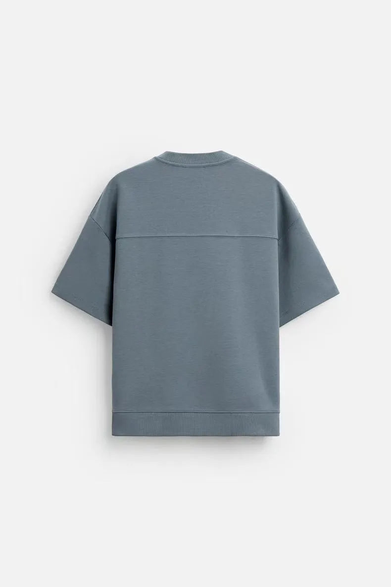 Loose double-sided cloth texture short sleeve top and matching shorts set in blue on a model.